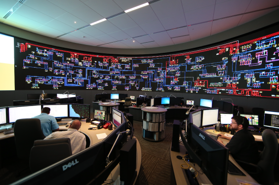 14840_3556_SCE_9474 A room with large monitors and employees looking at them and working