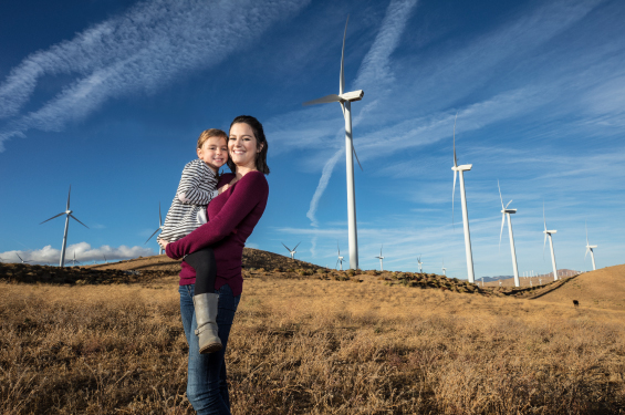 A woman carrying a child