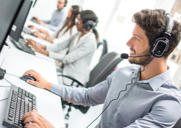 Happy man smiling looking at screen