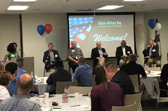 Five men sitting in a panel