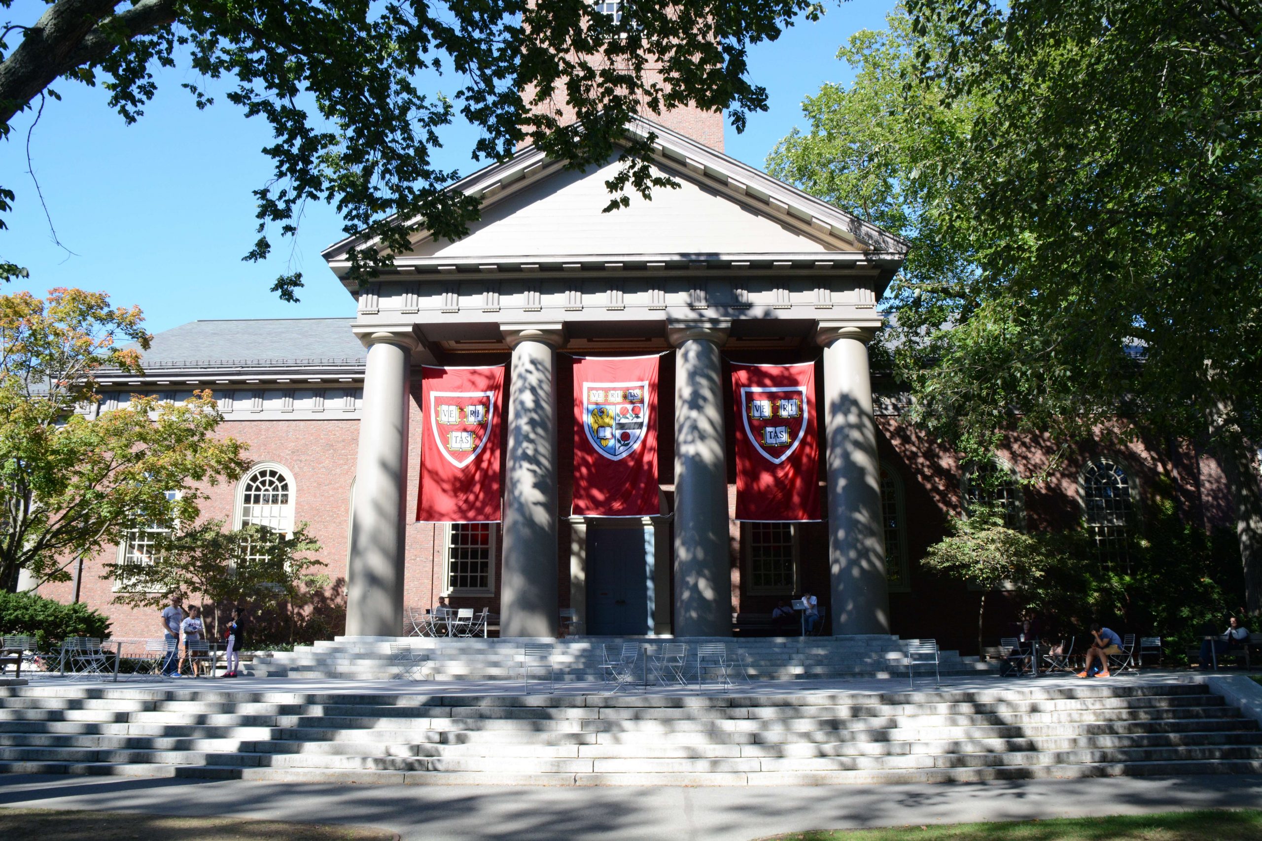 A building with harvard flags