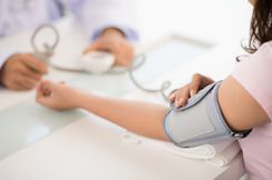 Someone having their blood pressure measured