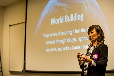 A woman standing and speaking